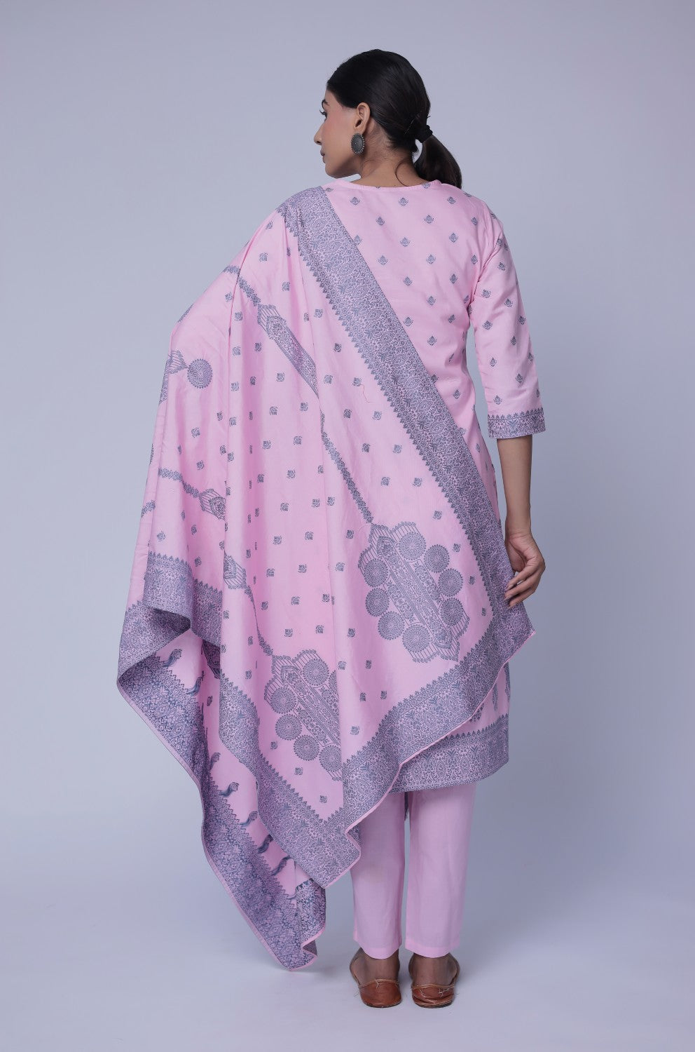 Back view of the baby pink cotton jacquard dupatta set, showing the consistent pattern on the kurti and pants, with the matching patterned dupatta.