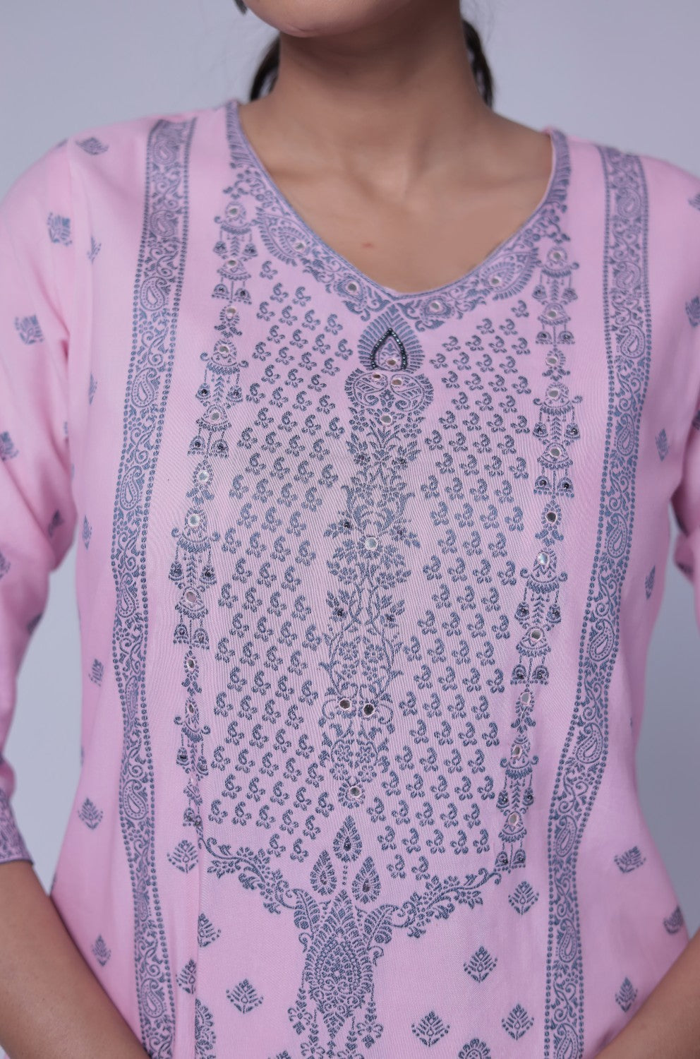 Close-up of the exquisite grey merging embroidery on the V-neckline and front of the baby pink cotton jacquard kurta, highlighting intricate craftsmanship.