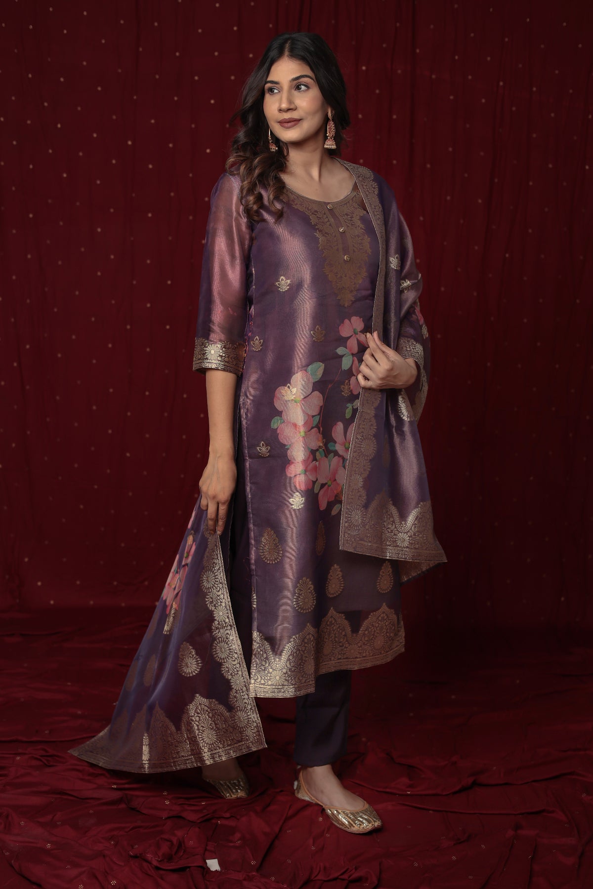 Flat lay arrangement of the complete deluxe jacquard organza purple suit set, including the richly printed kurti, matching jacquard dupatta, and soft silk pant.