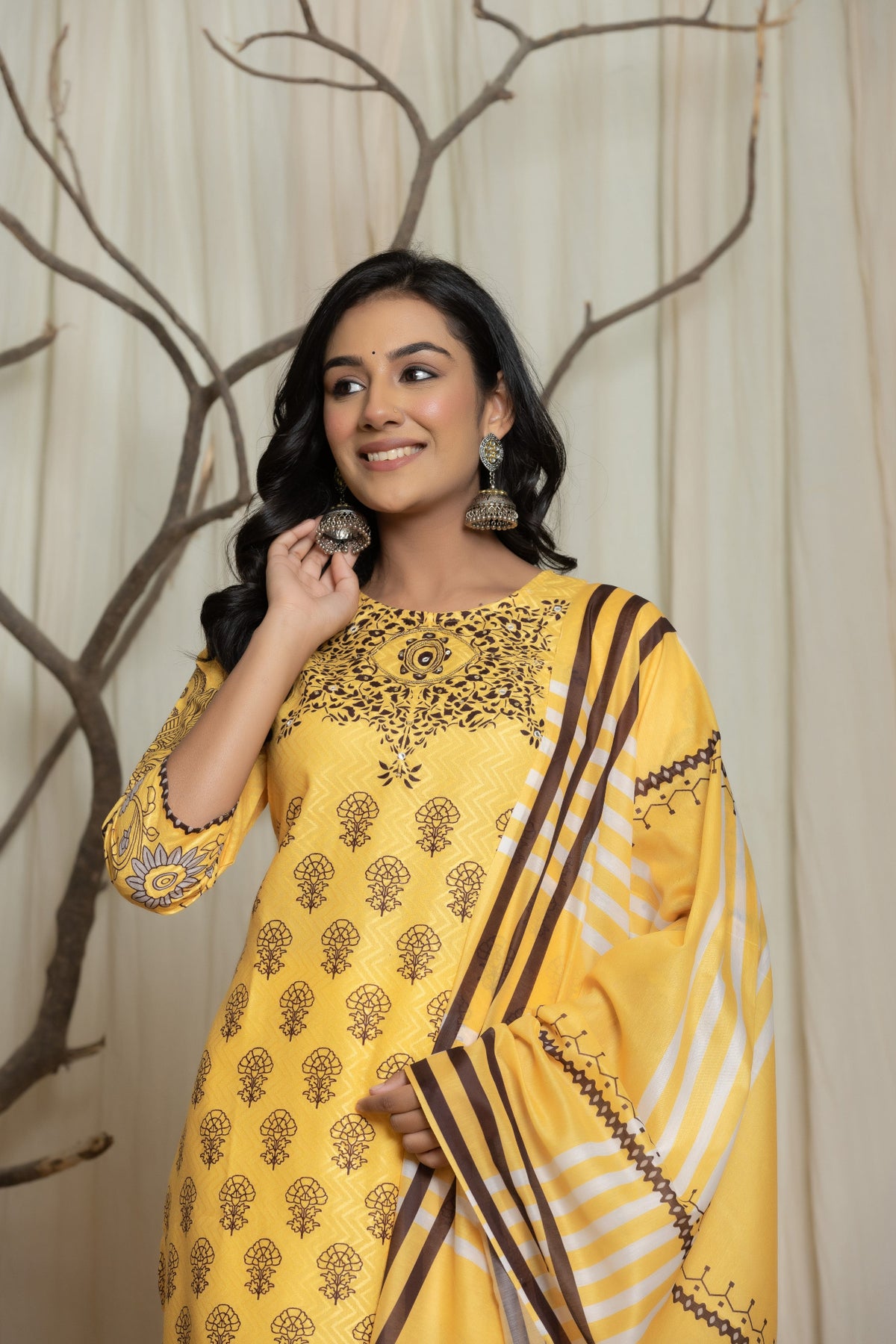 Side profile of model showcasing the comfortable fit and elegant drape of the elegant yellow Lapet digital print dupatta set with handwork.