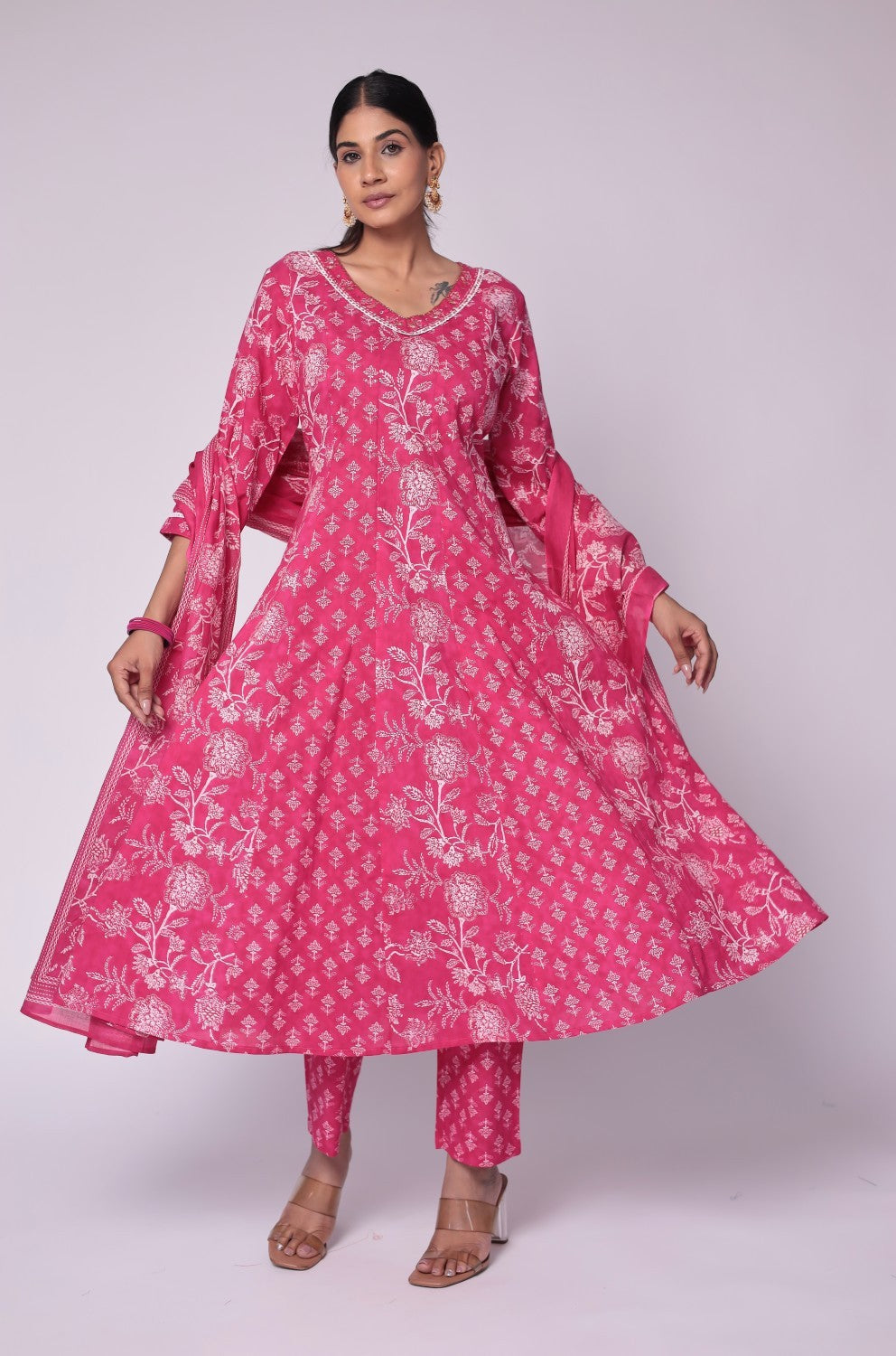 Model gracefully posing in the fuchsia pink cotton Anarkali Jaipuri print dupatta set, showcasing the comfortable movement and elegant flow of the outfit.