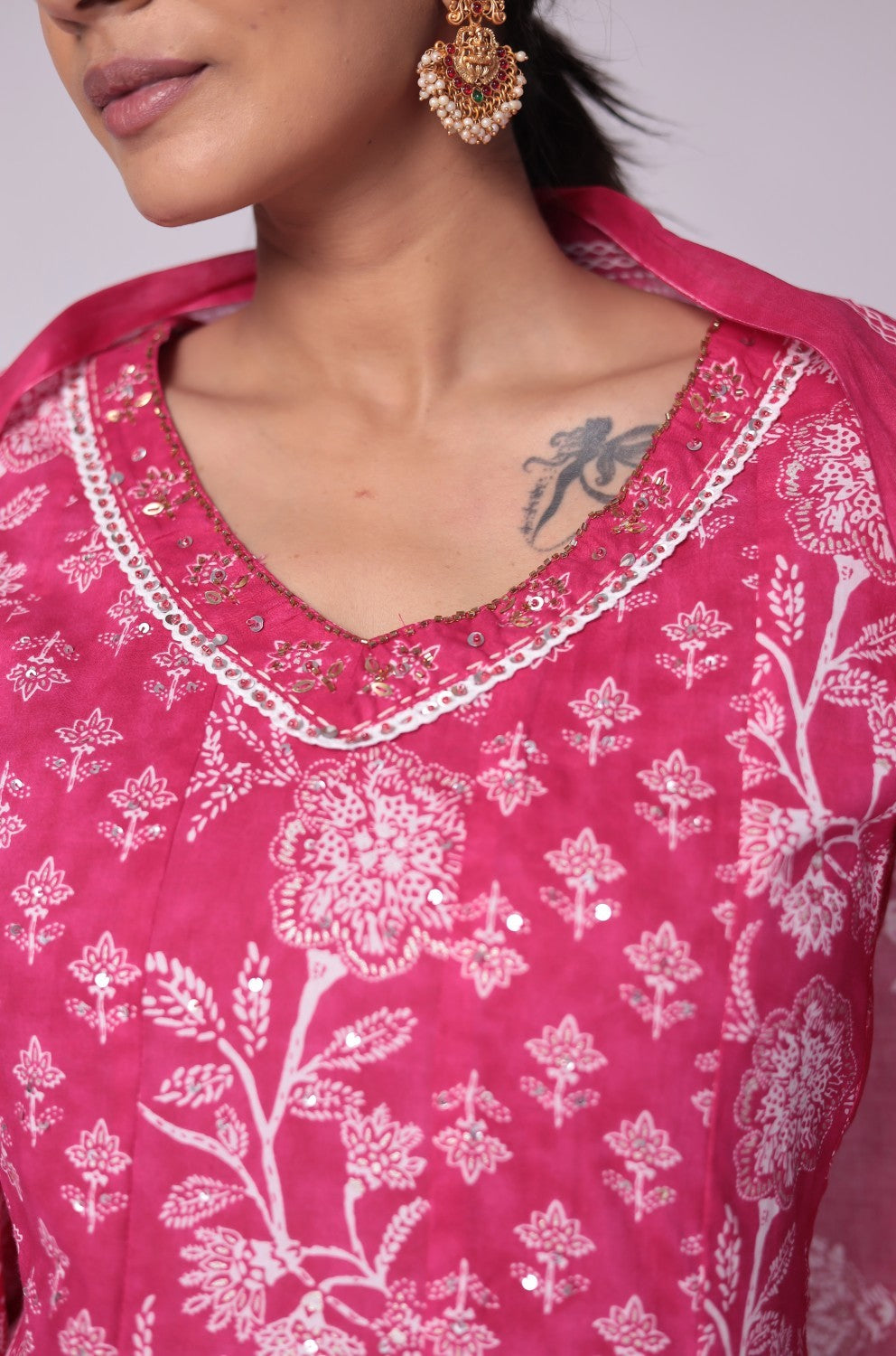 Detailed view of the vibrant fuchsia pink Jaipuri print on the soft cotton dupatta, showcasing its pattern and fabric texture, from the Anarkali set.