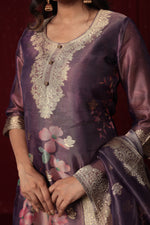 Detailed view of the luxurious purple jacquard organza dupatta with vibrant floral prints and prominent gold woven designs, complementing the suit.