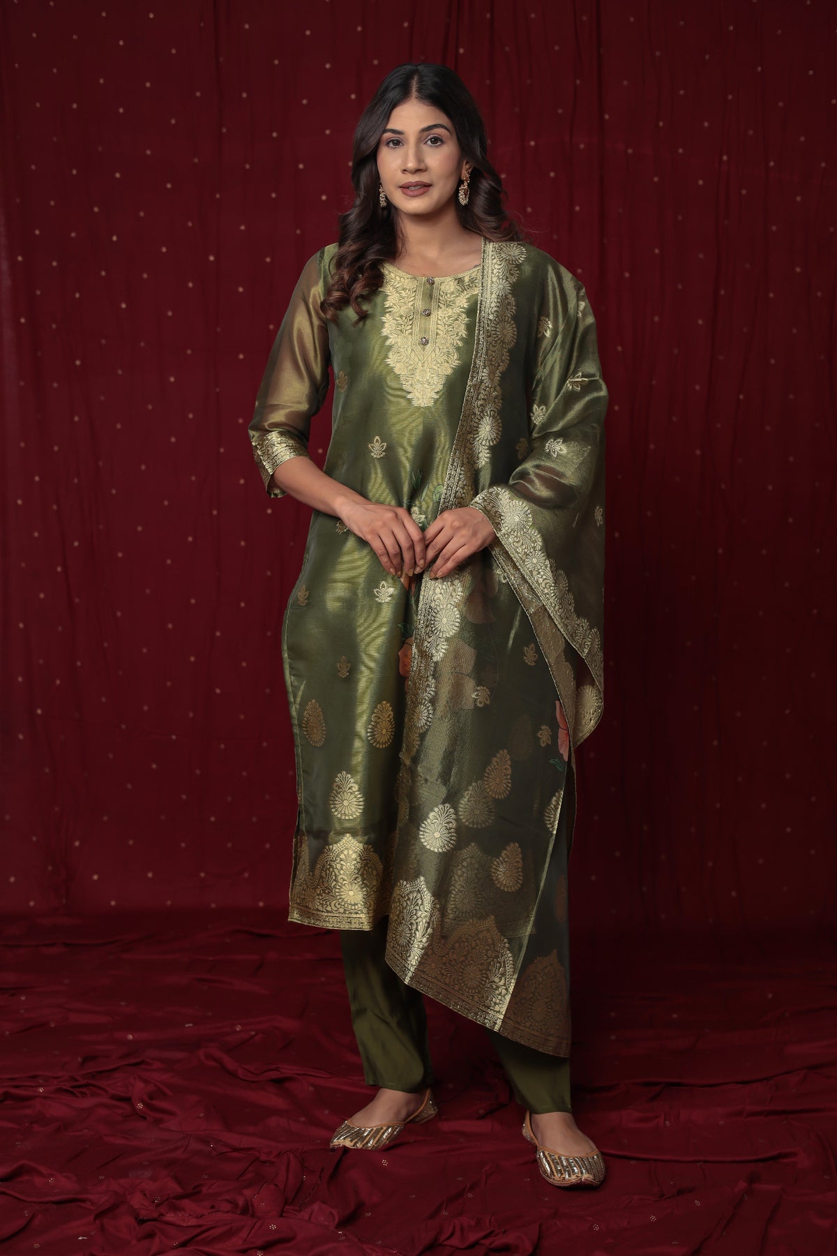 Close-up of the sheer yet rich texture of the jacquard organza fabric on the kurti and dupatta, alongside the smooth feel of the soft silk pant, highlighting material quality.