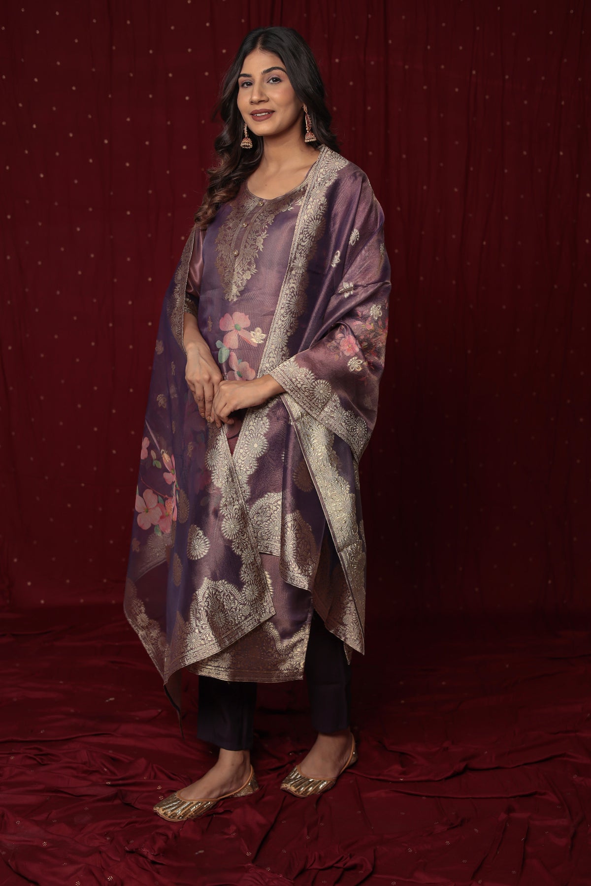 Close-up of the delicate yet rich texture of the jacquard organza fabric on the kurti and dupatta, alongside the smooth feel of the soft silk pant, highlighting material quality.