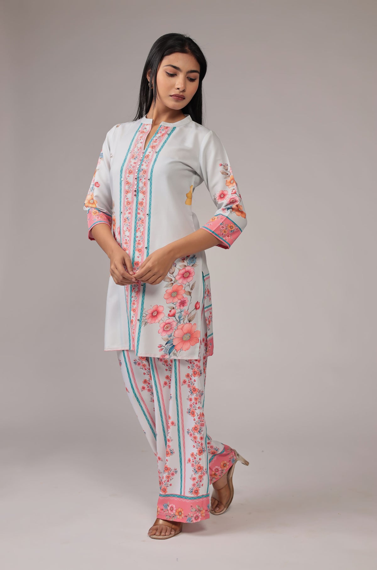 Side profile of model in a walking pose, showcasing the comfortable movement and graceful drape of the light grey digital print co-ord set.