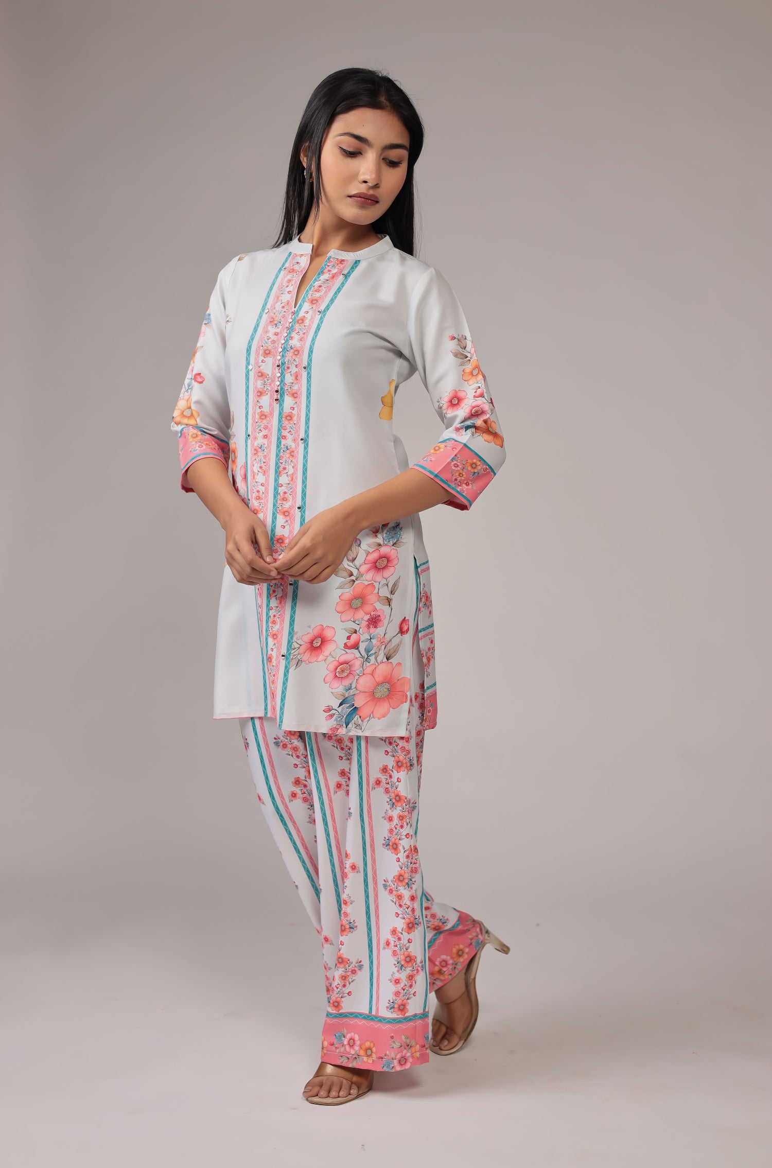 Side profile of model in a walking pose, showcasing the comfortable movement and graceful drape of the light grey digital print co-ord set.