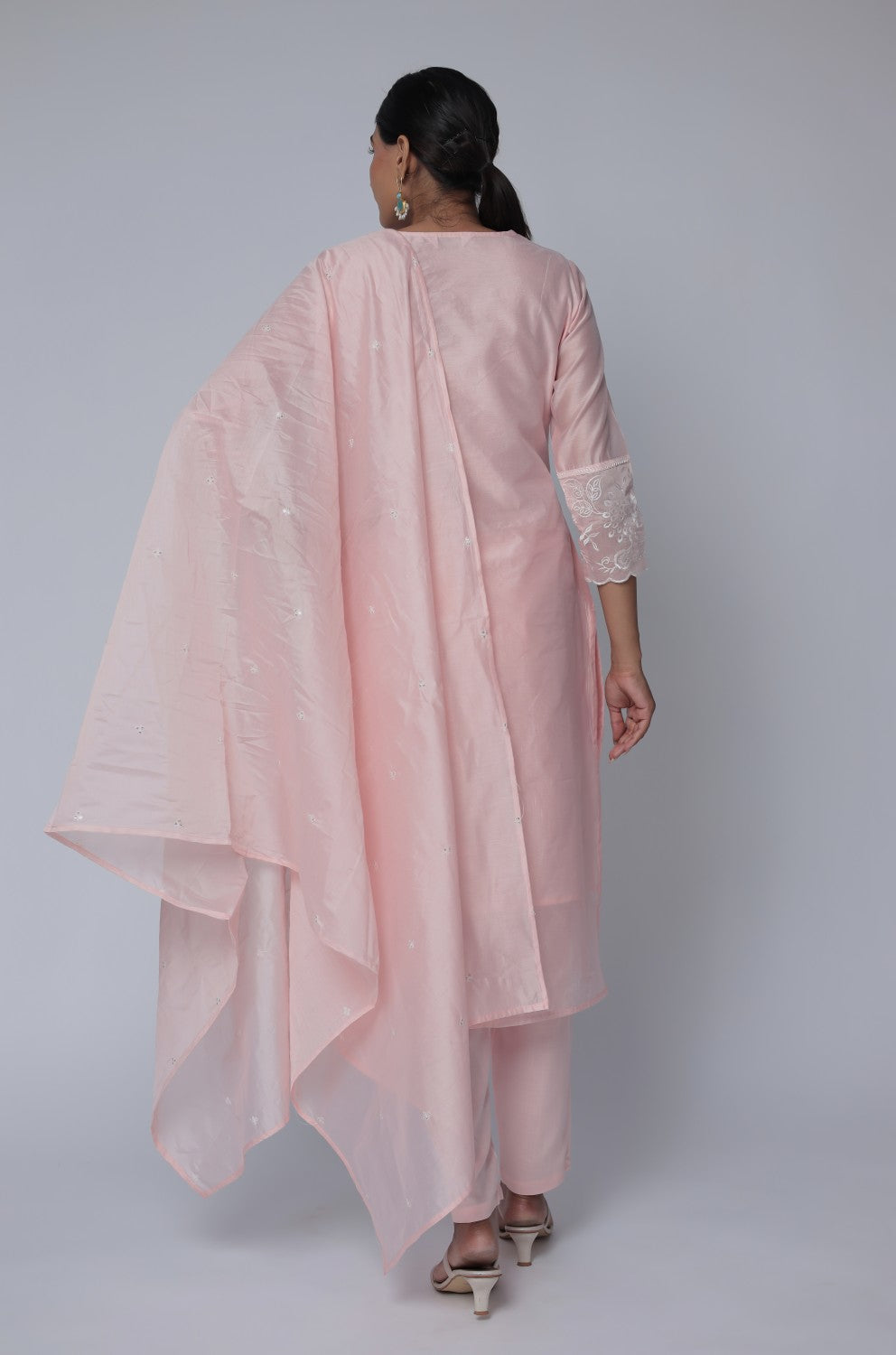 Back view of the light peach Chanderi dupatta set, showing the elegant silhouette and subtle all-over embroidery on the kurta and pants.
