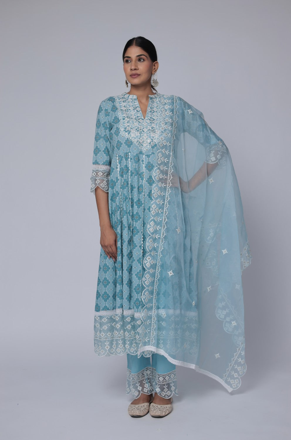 Model wearing a beautiful ocean blue Anarkali cotton dupatta set from The Navra, featuring exquisite white thread work on the flowing kurta and a sheer matching dupatta. Ideal for comfortable festive or elegant casual wear.