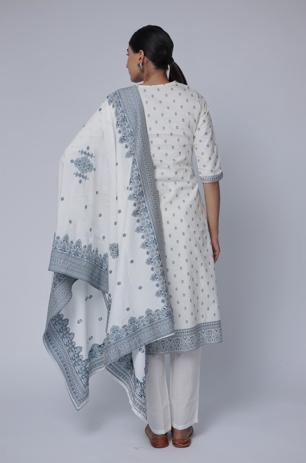 Back view of the off-white cotton jacquard dupatta set, showing the consistent pattern on the kurti and pants, with the matching patterned dupatta.