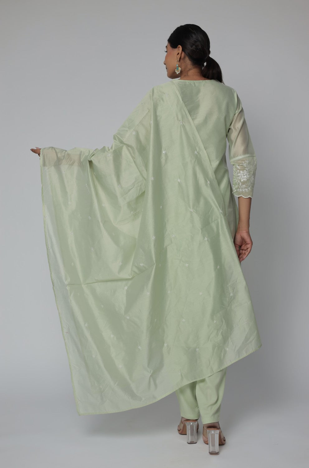 Back view of the pestal green Chanderi dupatta set, showing the elegant silhouette and subtle all-over embroidery on the kurti and pants.