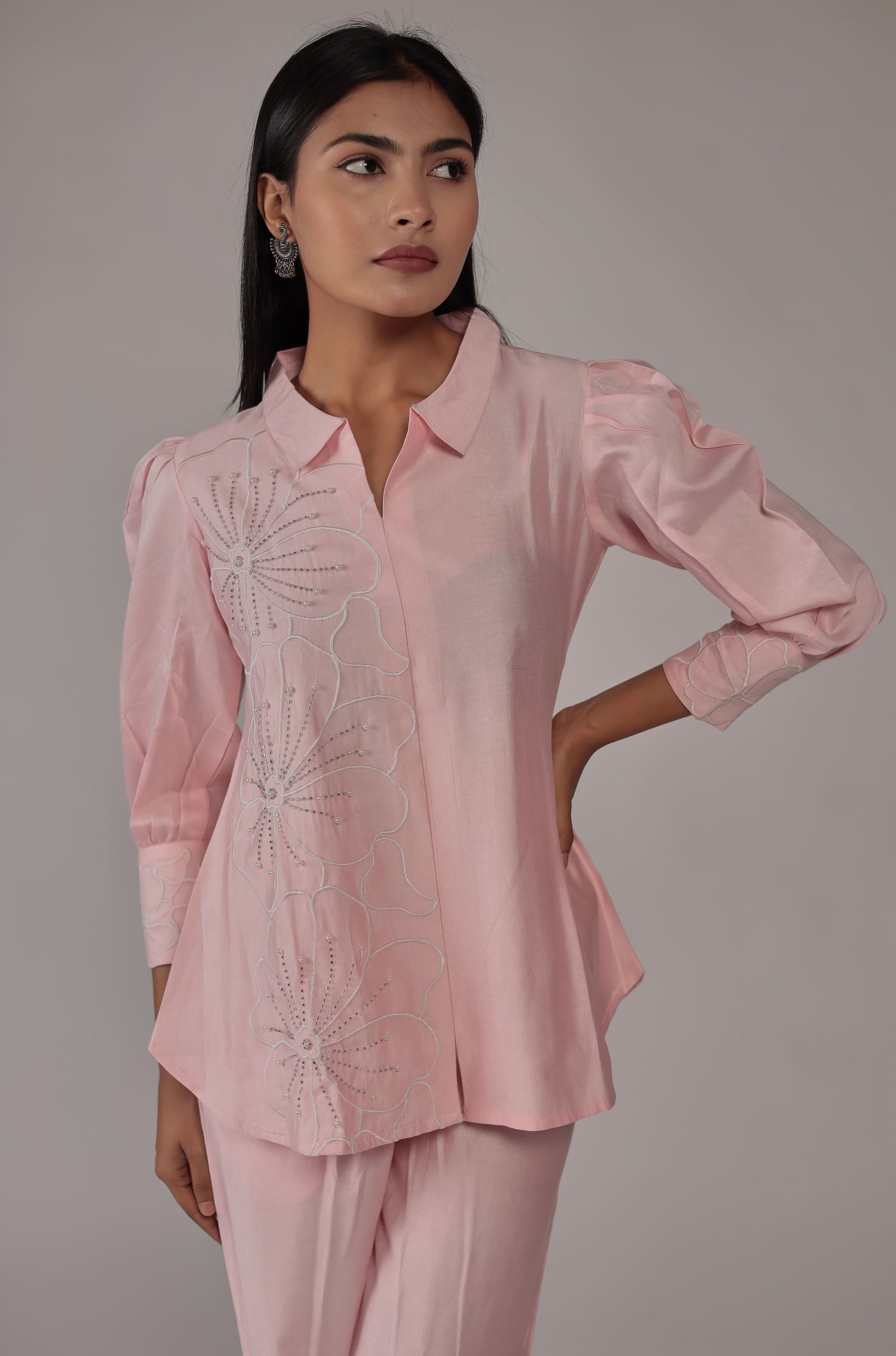 Close-up of the creative design work and subtle patterns on the top of the classy pink co-ord set.