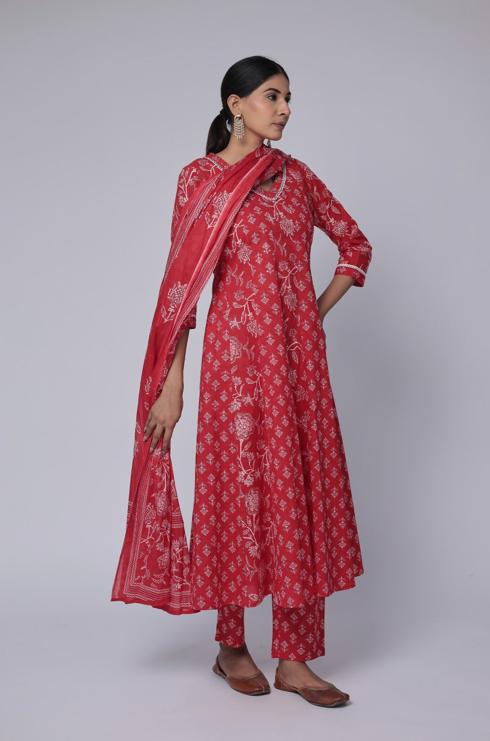 Model in a relaxed stance, highlighting the full length and comfortable design of the red cotton Anarkali set with Jaipuri print.