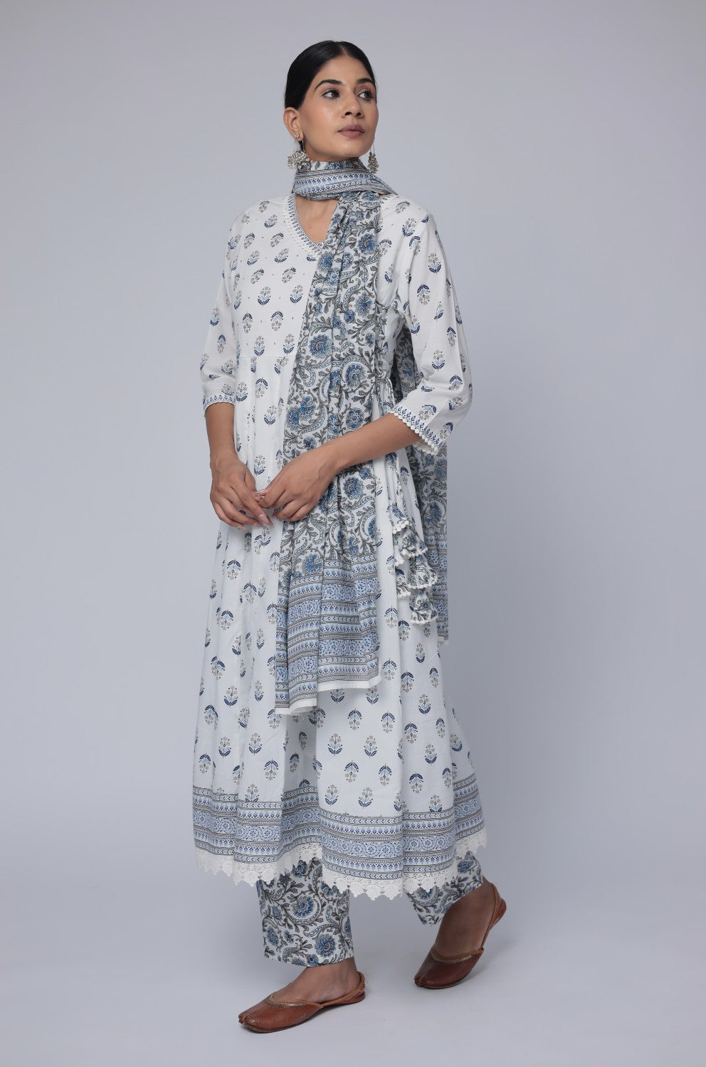 Model gracefully posing in the white and blue cotton Anarkali Jaipuri print dupatta set, showcasing the comfortable movement and elegant flow of the outfit.
