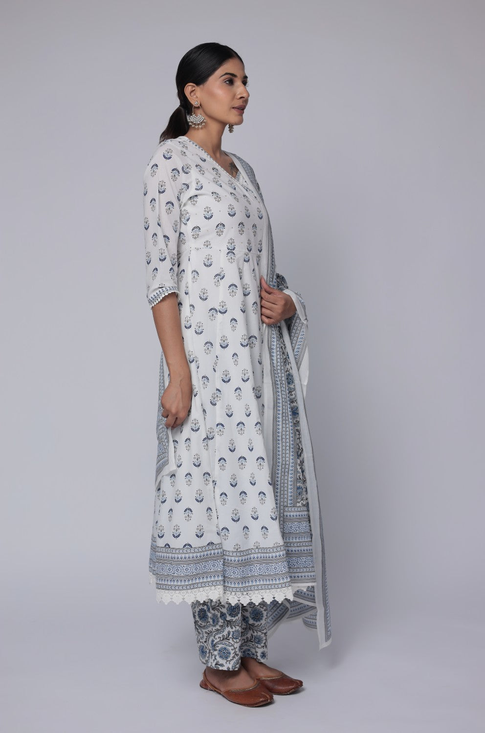 Model in a relaxed stance, highlighting the full length and comfortable design of the white and blue cotton Anarkali set with Jaipuri print.