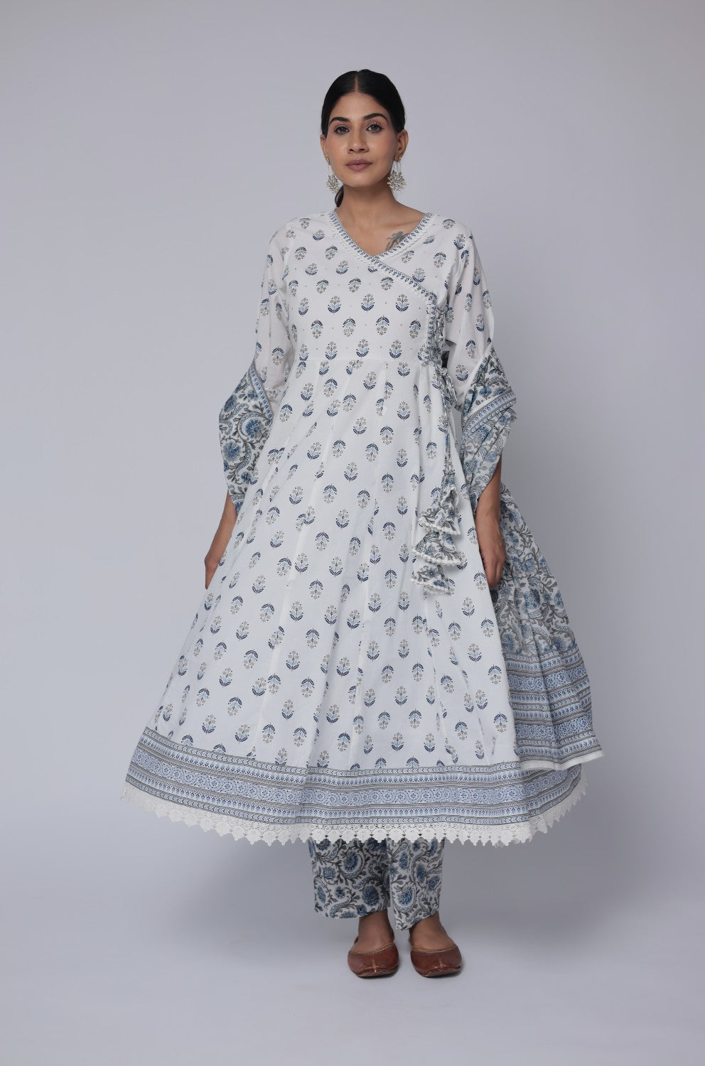 Side view of model showcasing the long, elegant trail of the white and blue Jaipuri print dupatta, complementing the cotton Anarkali set.