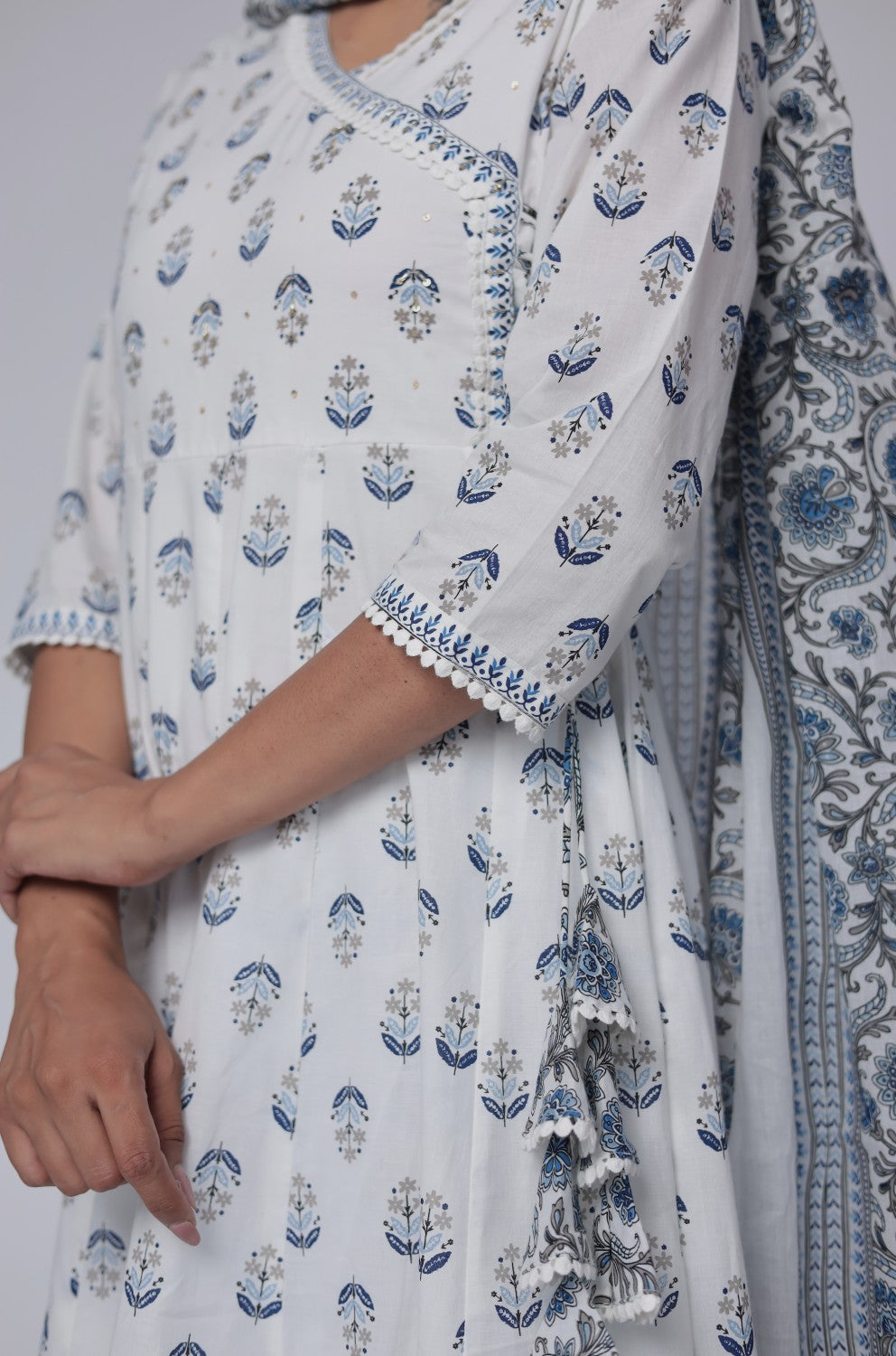 Detailed view of the sleeve and intricate Jaipuri print on the white and blue cotton Anarkali kurta, showcasing the intricate patterns.