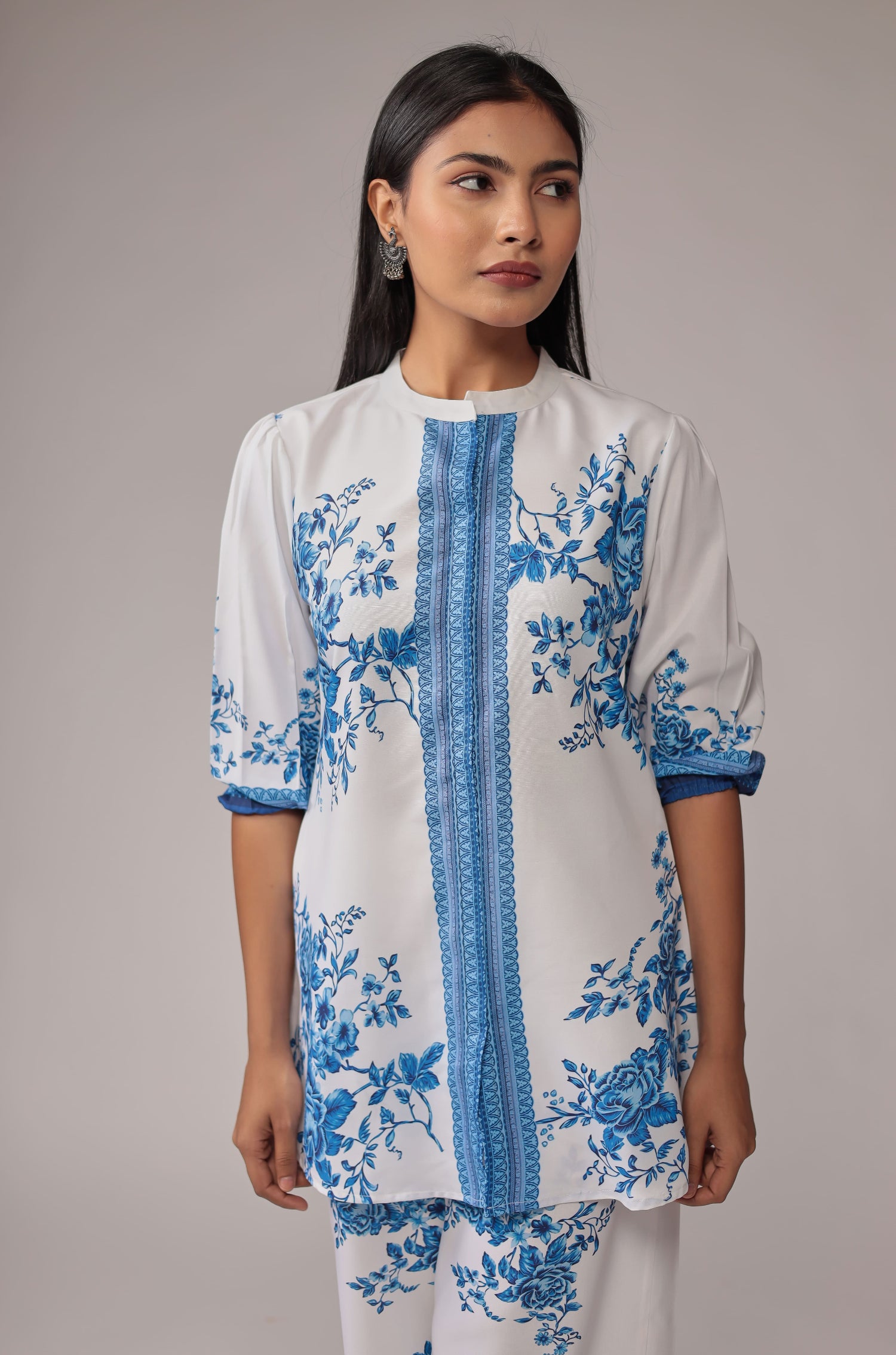 Close-up of the beautiful royal blue digital print and design on the neckline and upper body of the white kurta, from the co-ord set.