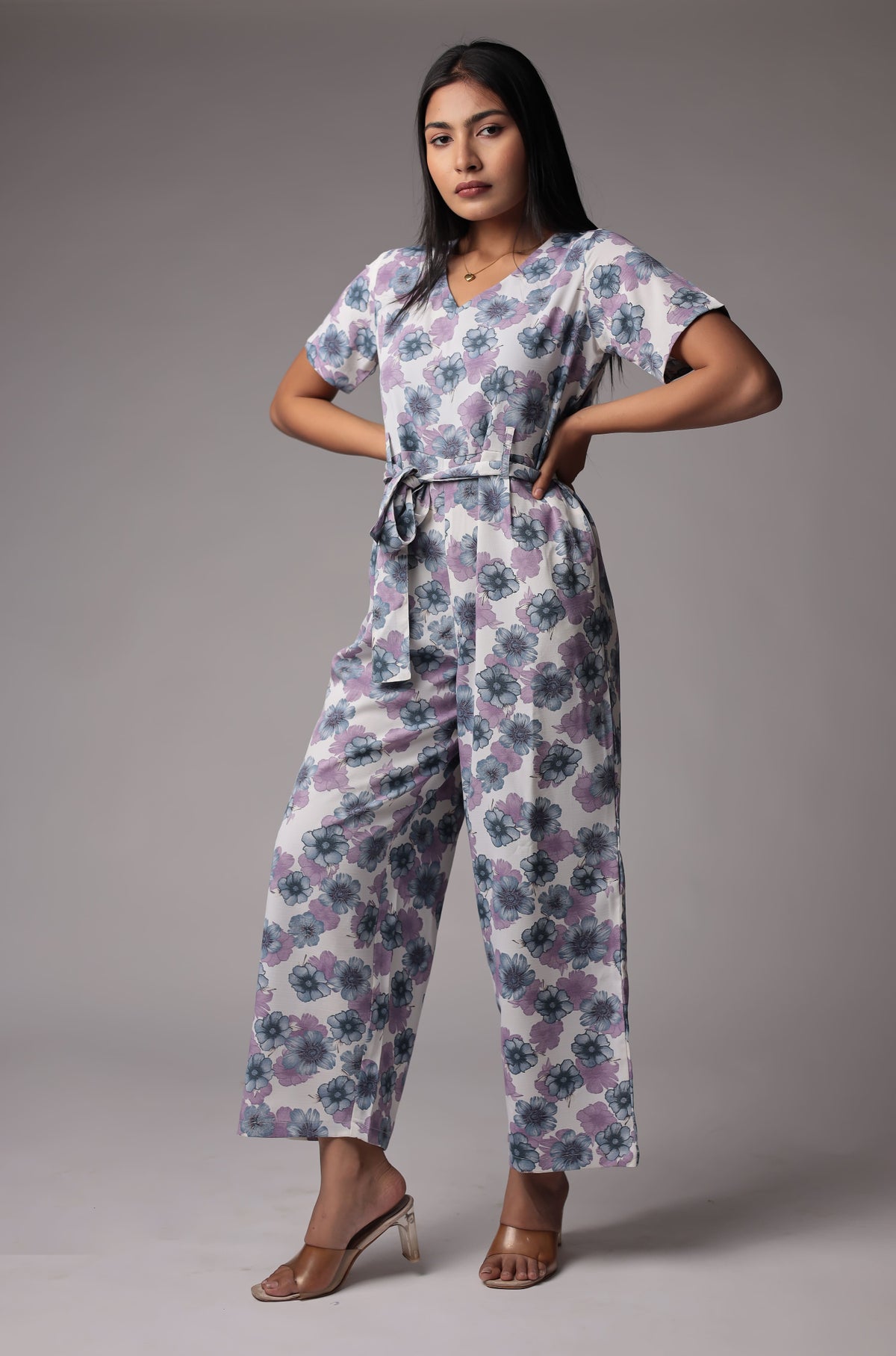 Model gracefully posing in the beautiful white floral print co-ord set, showcasing the comfortable movement and flow of the wide-leg pants.