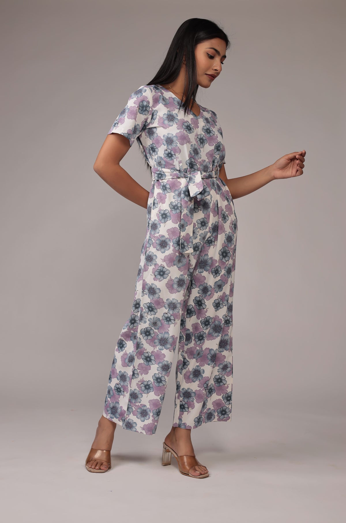 Model in a relaxed stance, highlighting the full length and overall beautiful design of the white floral print co-ord set.