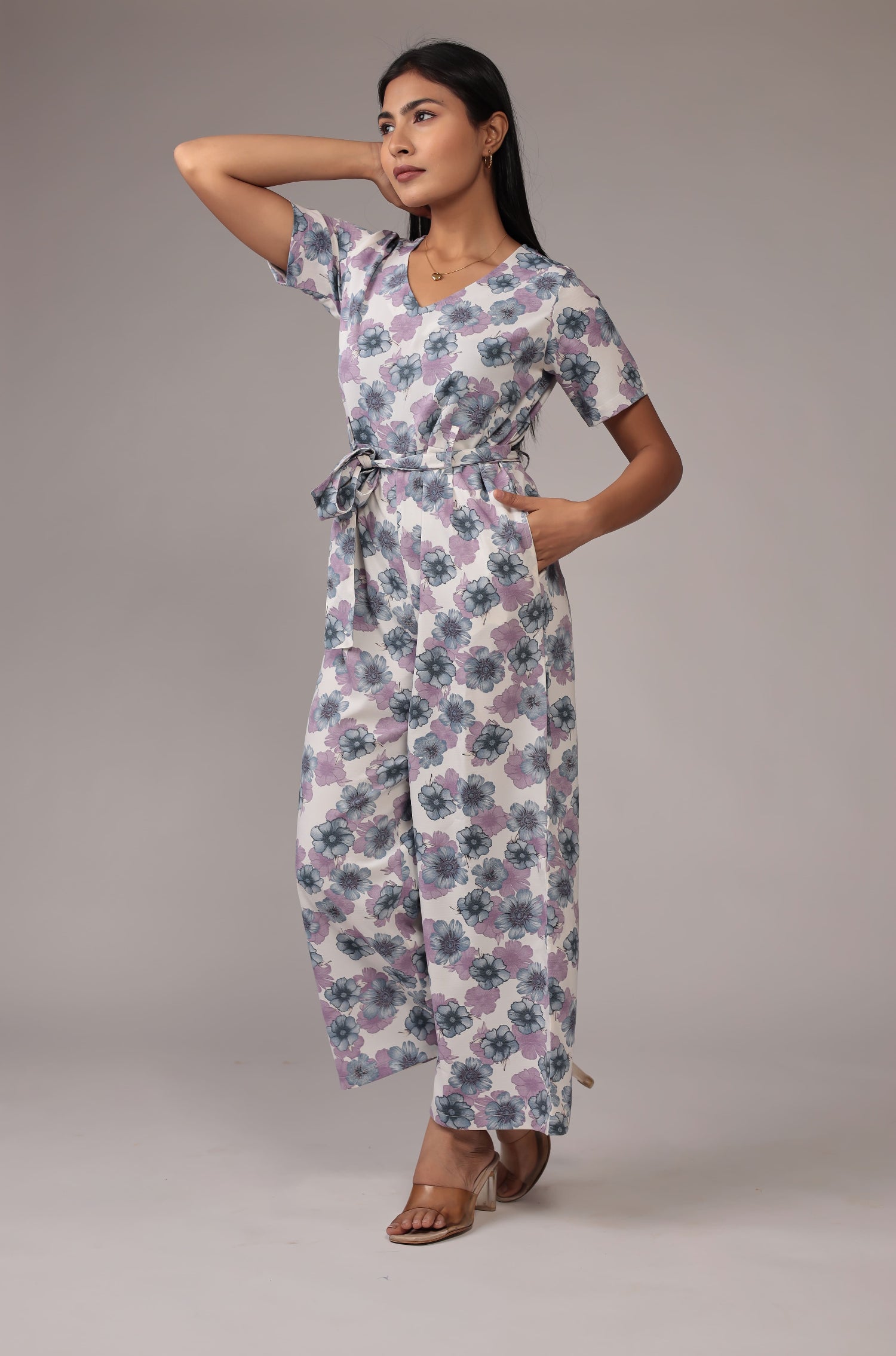 Side profile of model showcasing the relaxed fit and beautiful floral print of the white co-ord set.