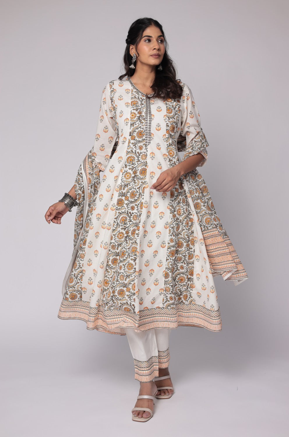 Flat lay arrangement of the complete white and yellow cotton Anarkali Jaipuri print dupatta set, including the handwork detailed kurta, printed dupatta, and matching pants, showcasing the full design.