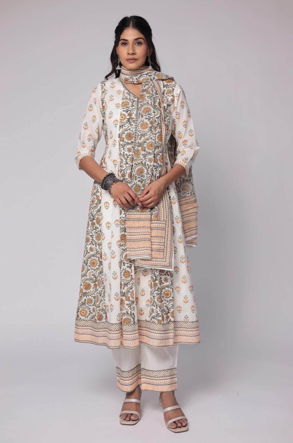 Model gracefully posing in the white and yellow cotton Anarkali Jaipuri print dupatta set, showcasing the comfortable movement and elegant flow of the outfit.