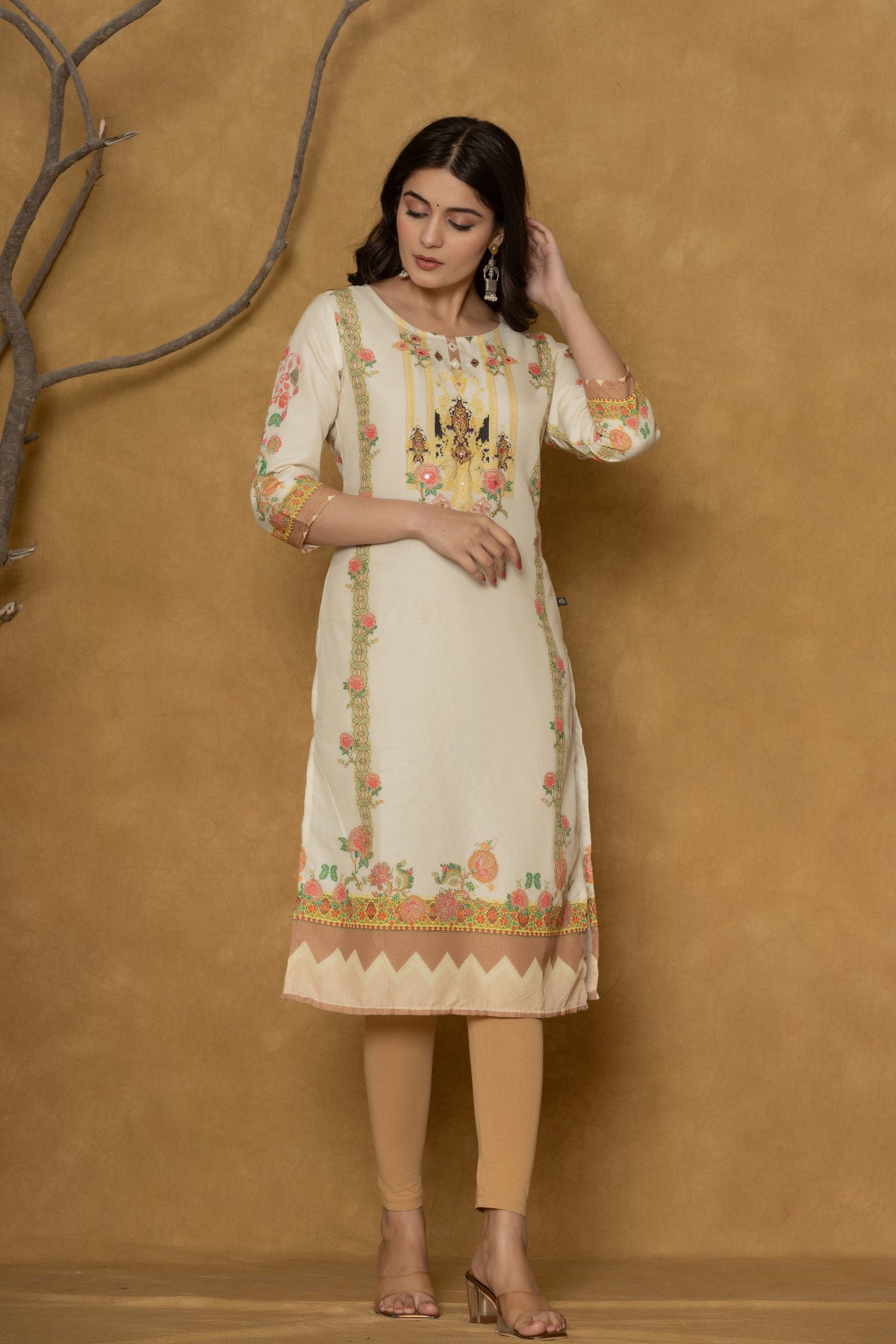 Model gracefully posing in the light yellow kurta with handwork, showcasing the comfortable movement and elegant style of the ethnic wear.