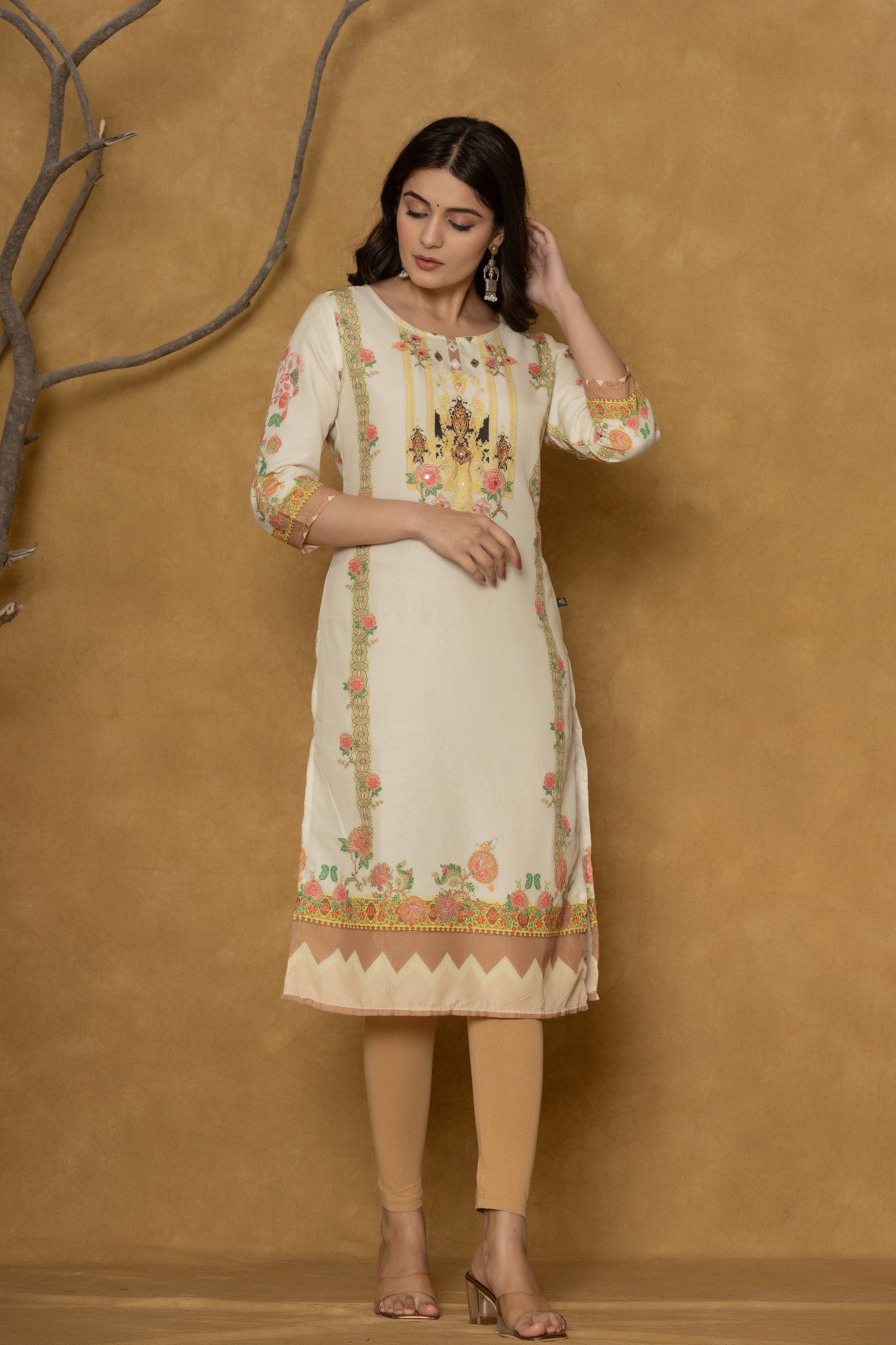Model gracefully posing in the light yellow kurta with handwork, showcasing the comfortable movement and elegant style of the ethnic wear.