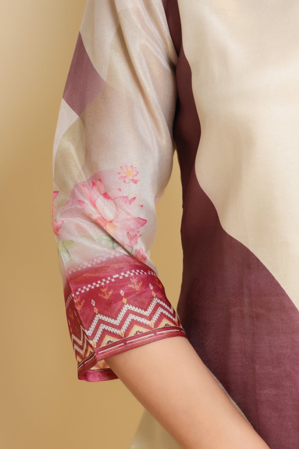 Detailed view of the vibrant digital print pattern on the sleeves of the cream kurti, showcasing the intricate design.