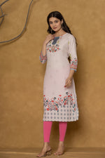 Model wearing a beautiful pink pannel kurta from The Navra, featuring intricate handwork on the neck and delicate floral patterns along the hemline, paired with pink leggings. Ideal for casual and daily wear.