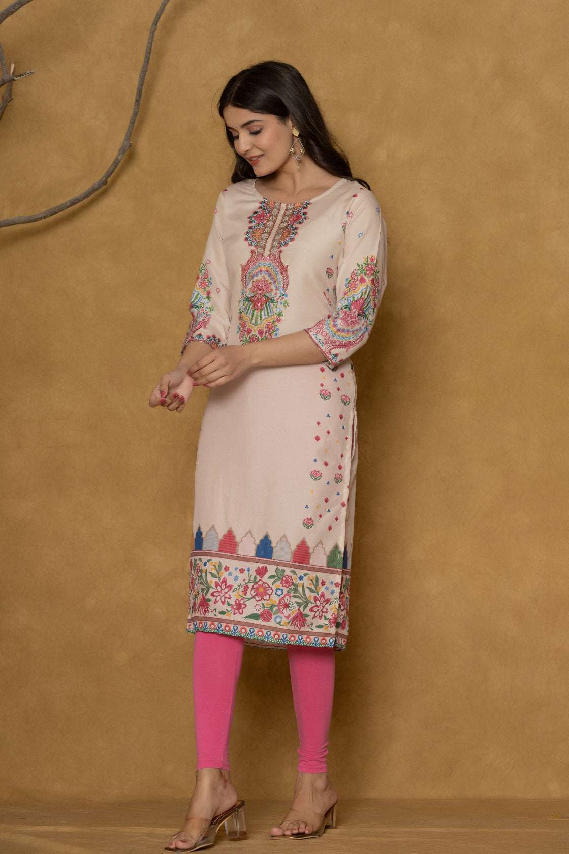 Model in a different pose wearing the beige pannel kurta, highlighting the full length and the intricate pannel patterns.