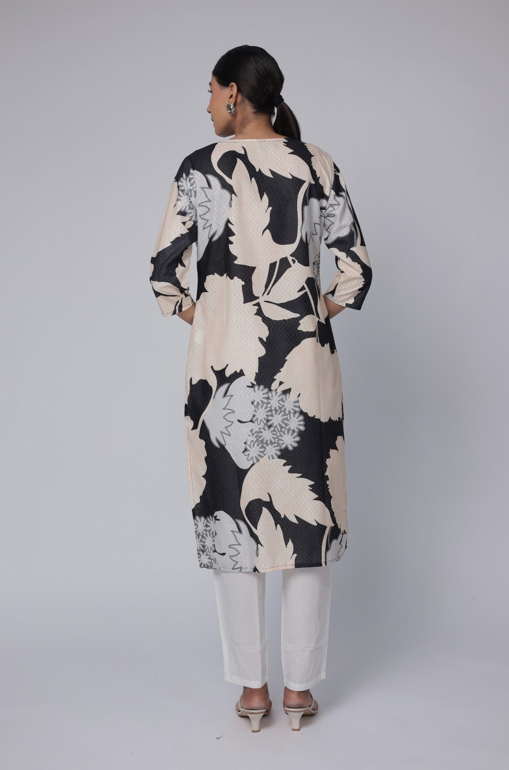 Back view of the black and beige multicolor premium cotton dobby kurti, showing the consistent abstract print and comfortable silhouette.
