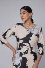 Side profile of model showcasing the comfortable fit and unique abstract design of the black and beige multicolor cotton dobby kurti.