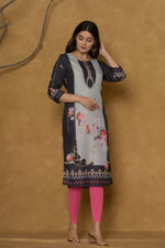 Flat lay arrangement of the rich black pannel kurta, highlighting the overall design and the distinct patterns along the hemline.

