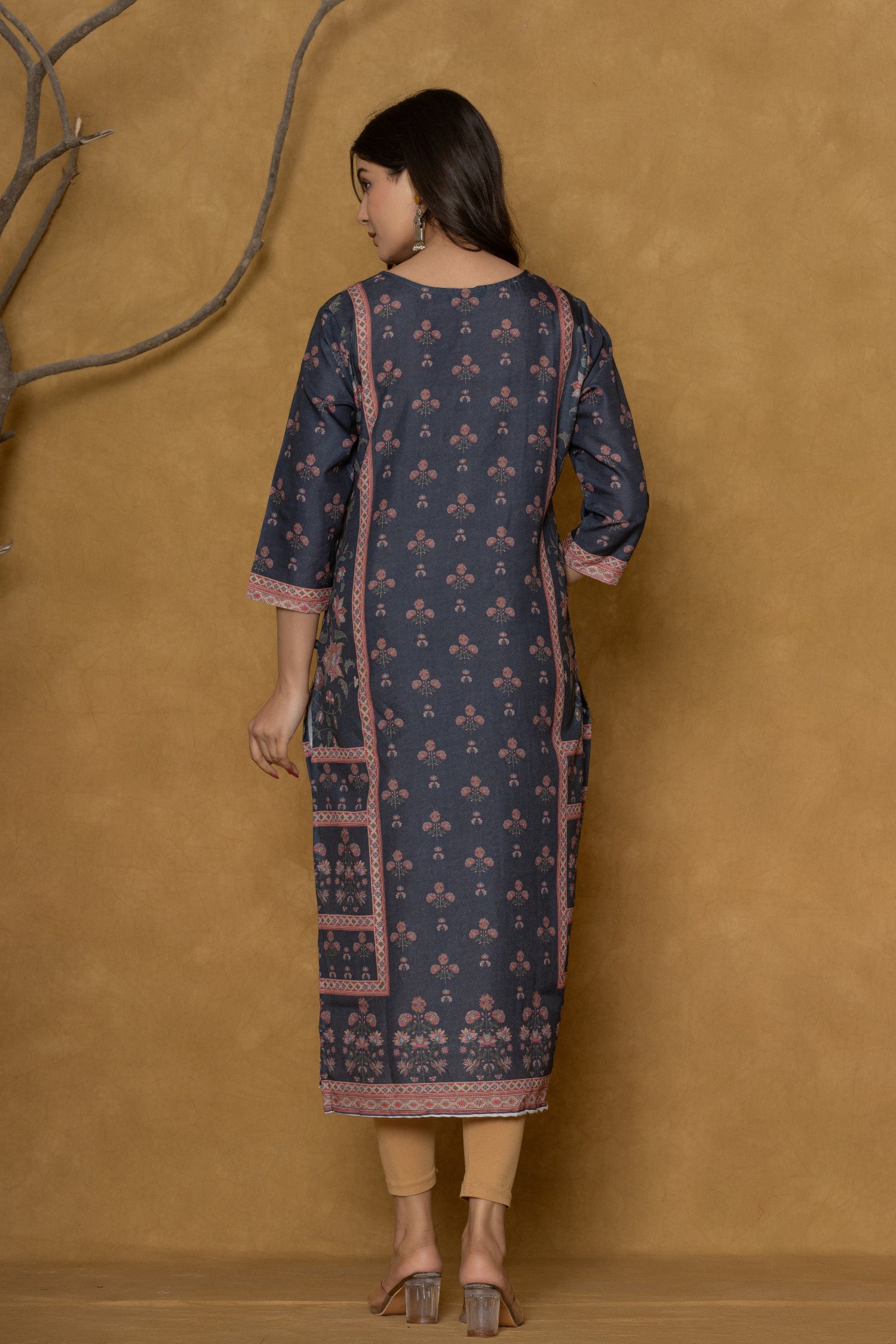 Model gracefully posing in the black kurta with handwork, showcasing the comfortable movement and elegant style of the ethnic wear.