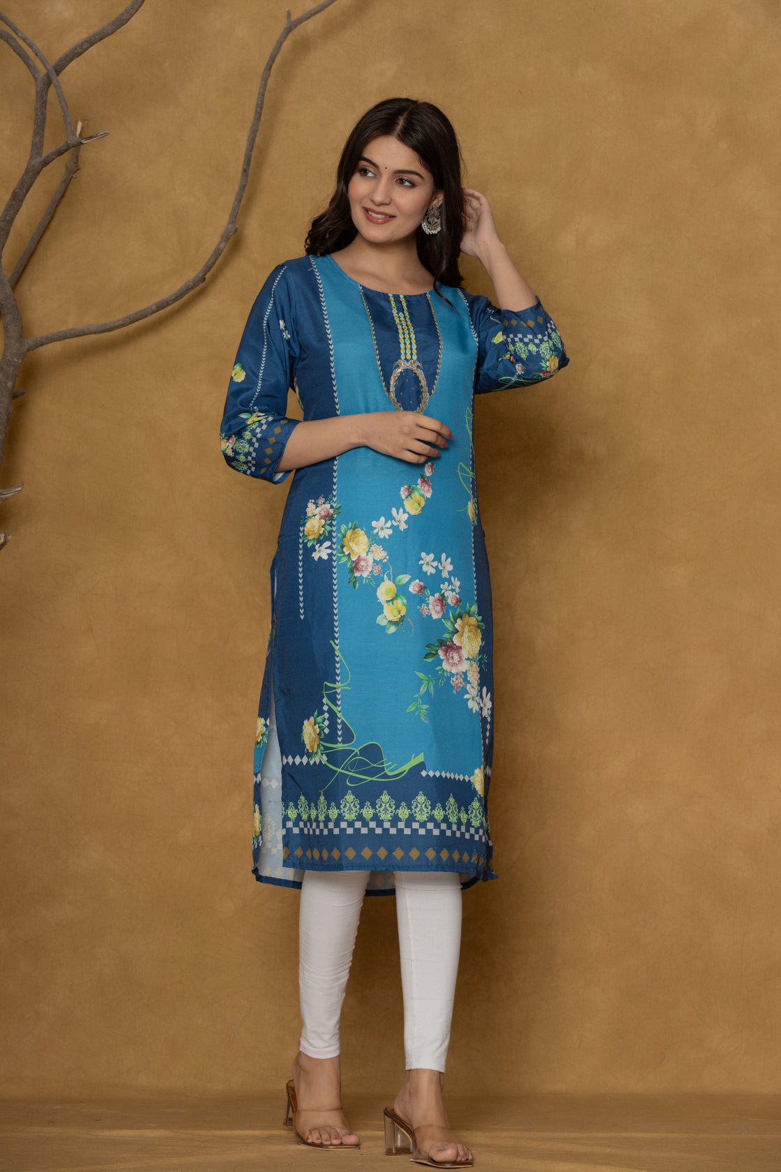 Model gracefully posing in the blue kurta with handwork and floral print, showcasing the comfortable movement and elegance of the ethnic wear.