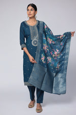 Model gracefully posing in the blue soft silk suit set, highlighting the beautiful flow and movement of the printed jacquard dupatta.