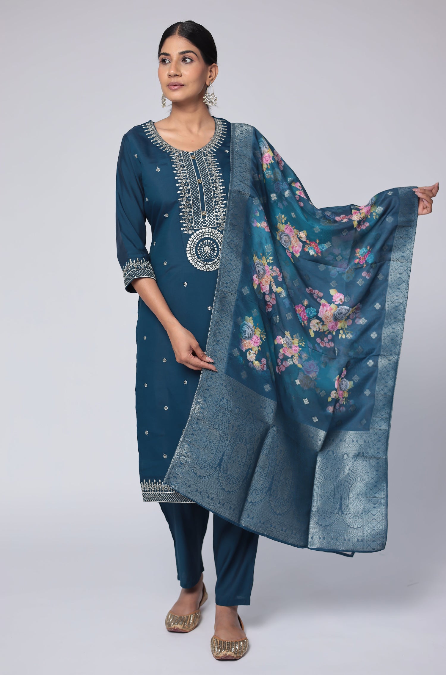 Model gracefully posing in the blue soft silk suit set, highlighting the beautiful flow and movement of the printed jacquard dupatta.