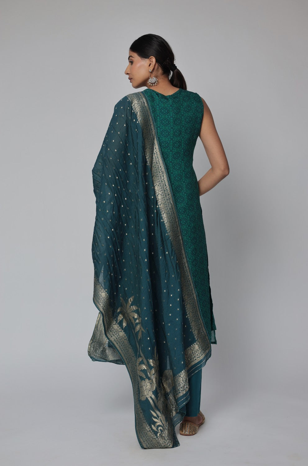 Back view of the bottle green Banarasi Jacquard Chanderi suit set, showing the elegant silhouette and consistent woven jacquard pattern on the kurti and dupatta.