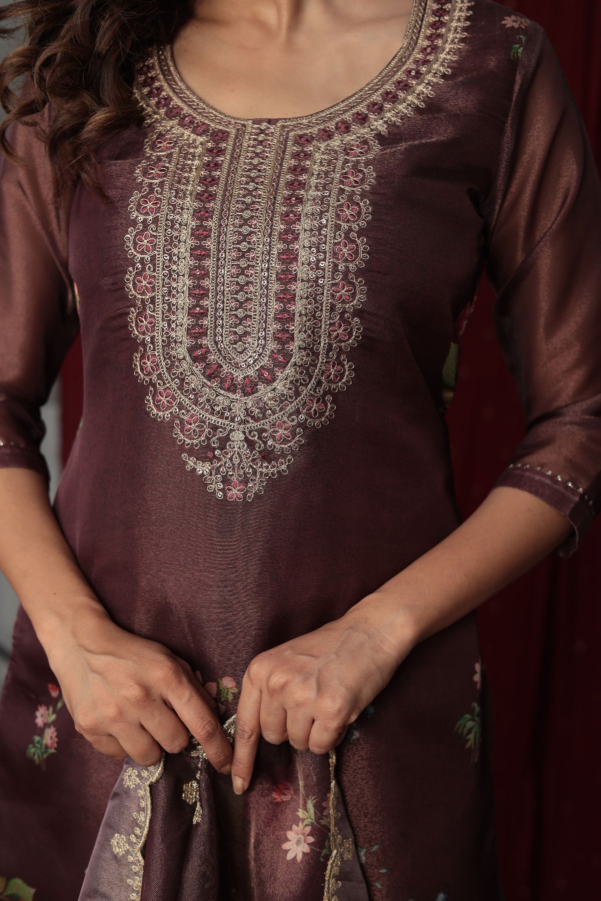 Close-up of the intricate silver and brown embroidery on the neckline of the deluxe shimmer organza brown kurti, highlighting craftsmanship.