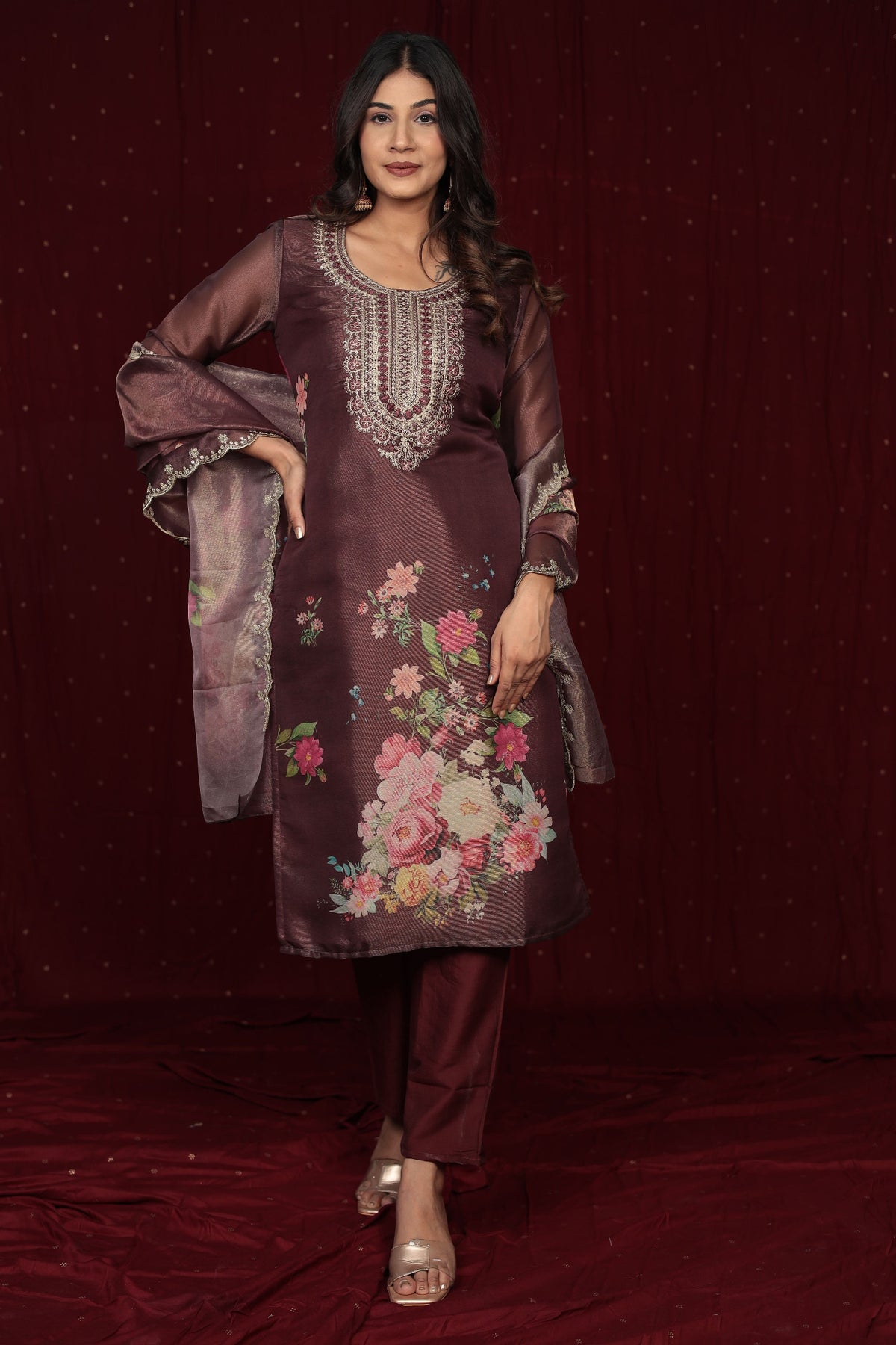 Side profile of model showcasing the elegant drape and flow of the deluxe shimmer organza brown suit.