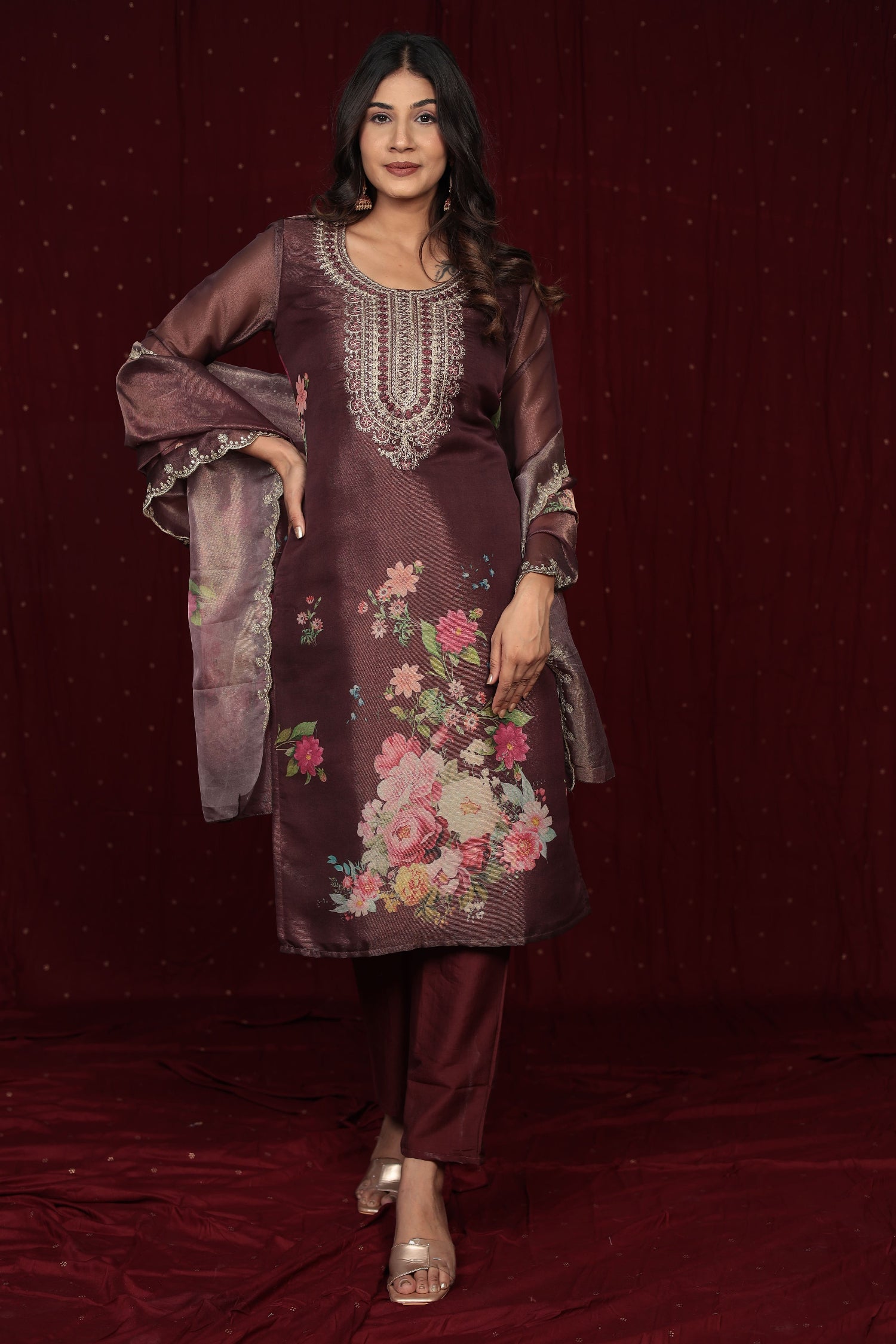 Side profile of model showcasing the elegant drape and flow of the deluxe shimmer organza brown suit.