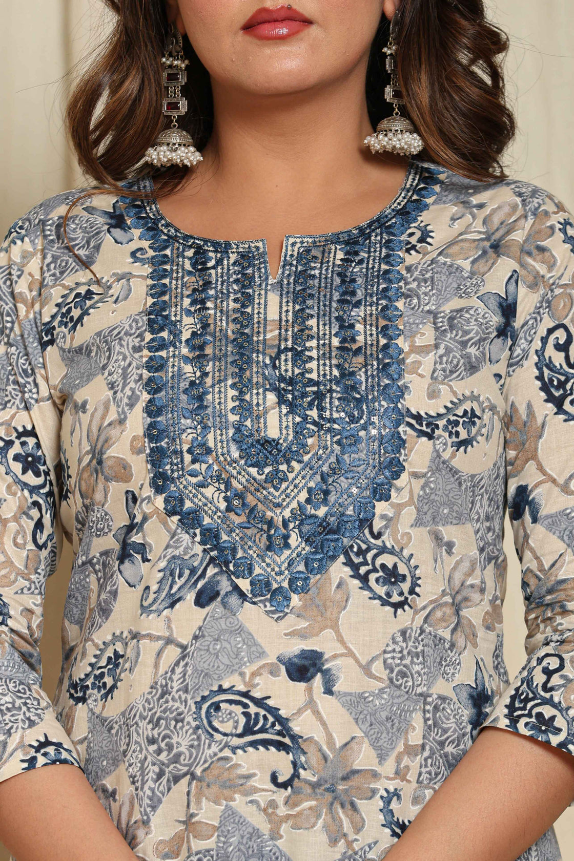 Close-up of the intricate blue and white floral print and detailing on the neckline of the premium cotton kurta, highlighting the design details.