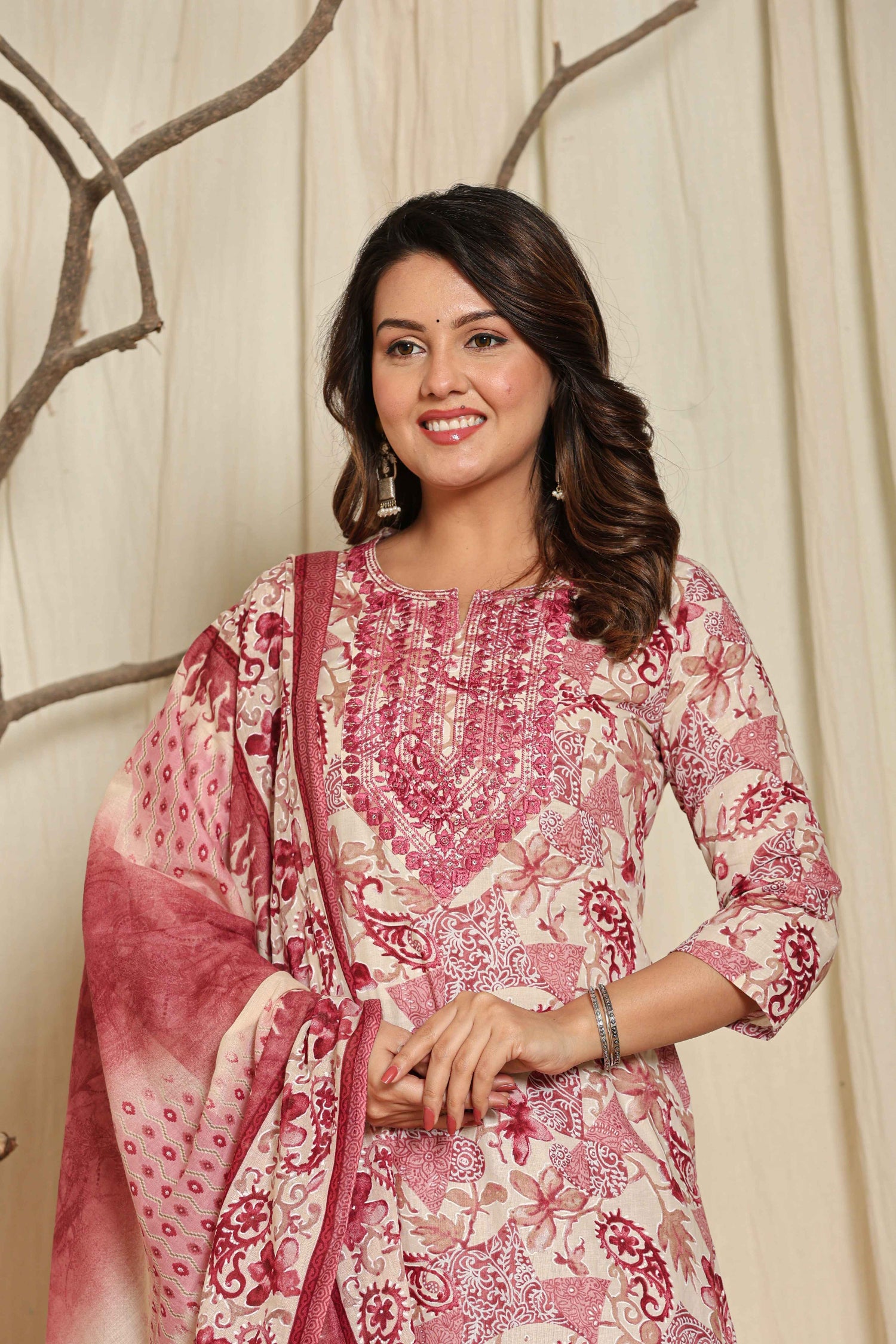 Close-up of the delicate floral print and intricate patterns on the neckline of the premium cotton kurti, highlighting the design details.