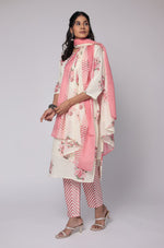 Detailed view of the striped pattern on the pants and the floral print on the mulmul dupatta of the cream and red Jaipuri set.
