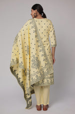 Back view of the cream yellow cotton jacquard dupatta set, showing the consistent jacquard pattern on the kurti and pants, with the matching patterned dupatta.

