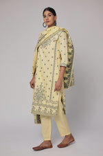 Close-up of the exquisite dark grey merging embroidery on the V-neckline and front of the cream yellow cotton jacquard kurta, highlighting intricate craftsmanship.