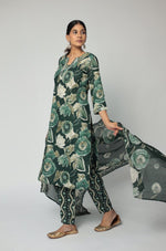 Model gracefully posing with the dark green Jaipuri print dupatta flowing, showcasing its full design and elegant movement.