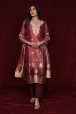 Back view of the deluxe jacquard organza maroon suit, showing the elegant fall of the fabric and the consistent jacquard pattern.